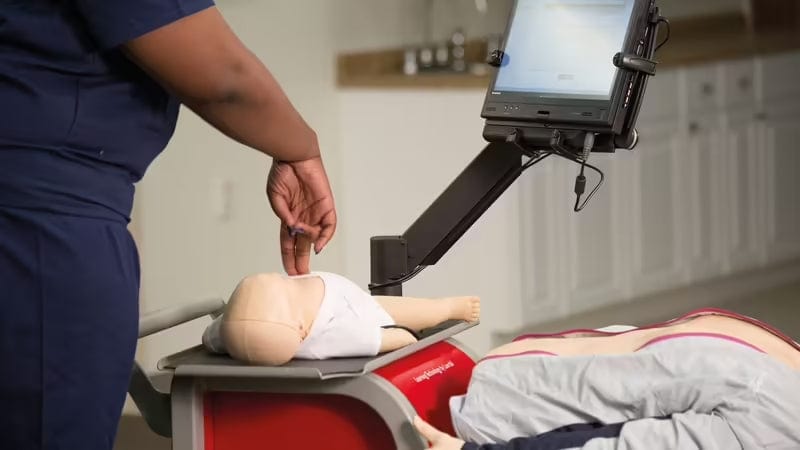 Baby CPR demonstration with compressions